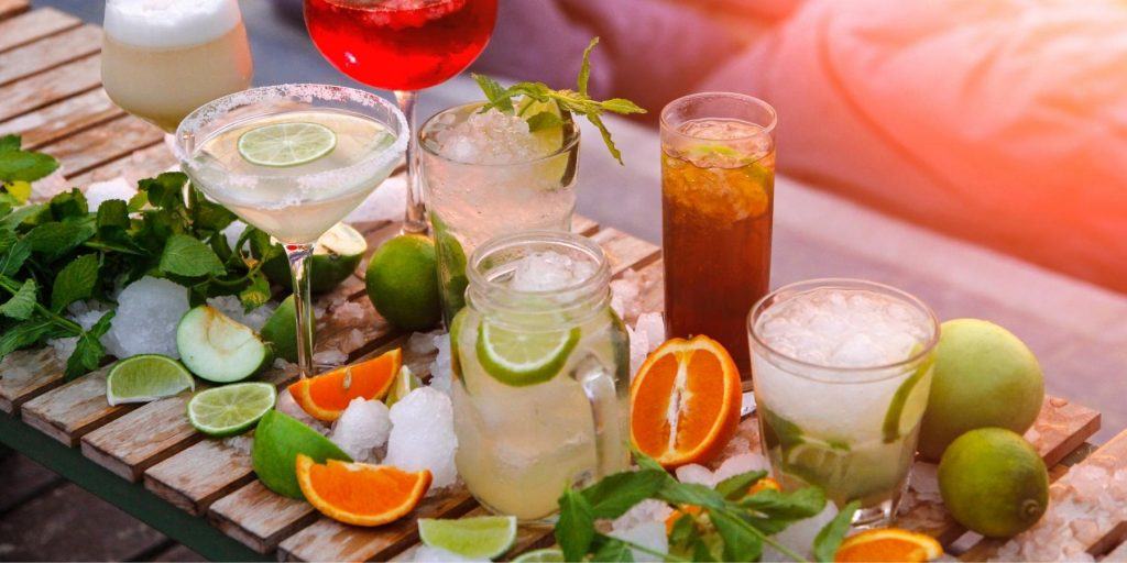 Variety of different cocktails on a wooden table