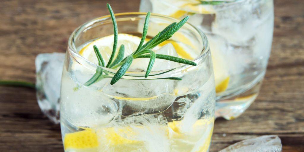 Glass of tequila and tonic with rosemary