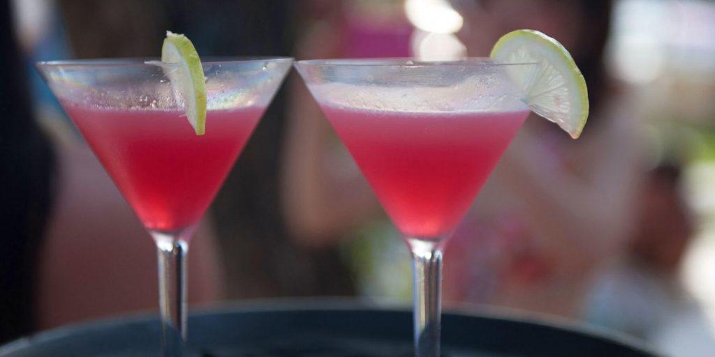 Two chilled strawberry vodka martinis