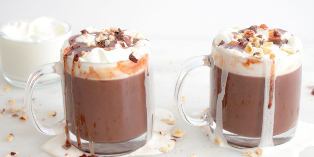 Tequila Hot Chocolates served in mugs with cream spice and nuts