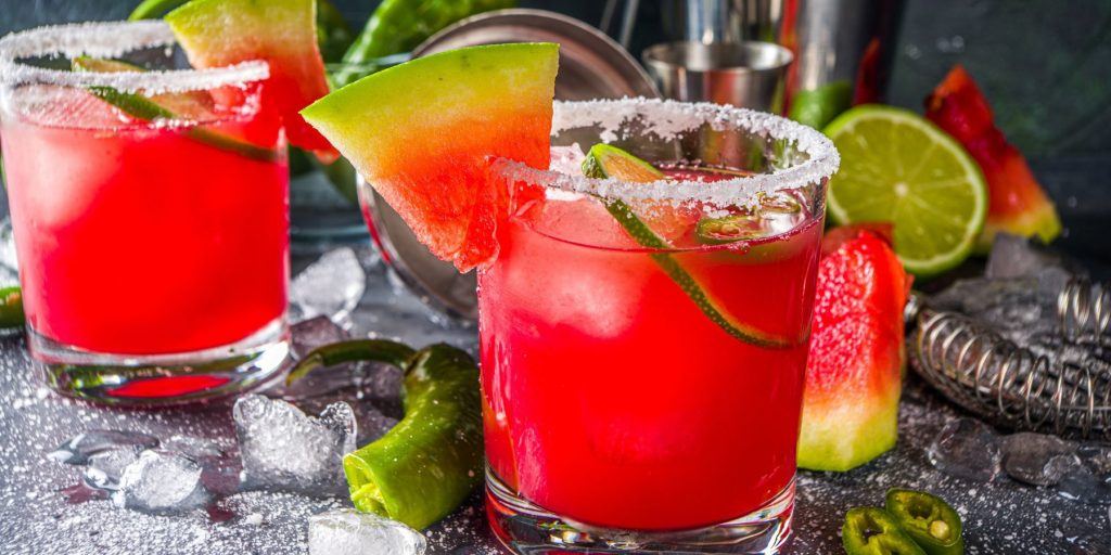 Close Up of Mexican Candy Cocktail garnished with watermelon wedges