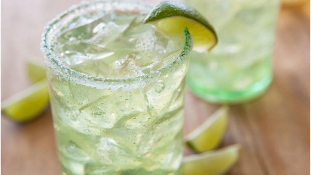 Skinny Lime Margaritas on the rocks garnished with lime wedges