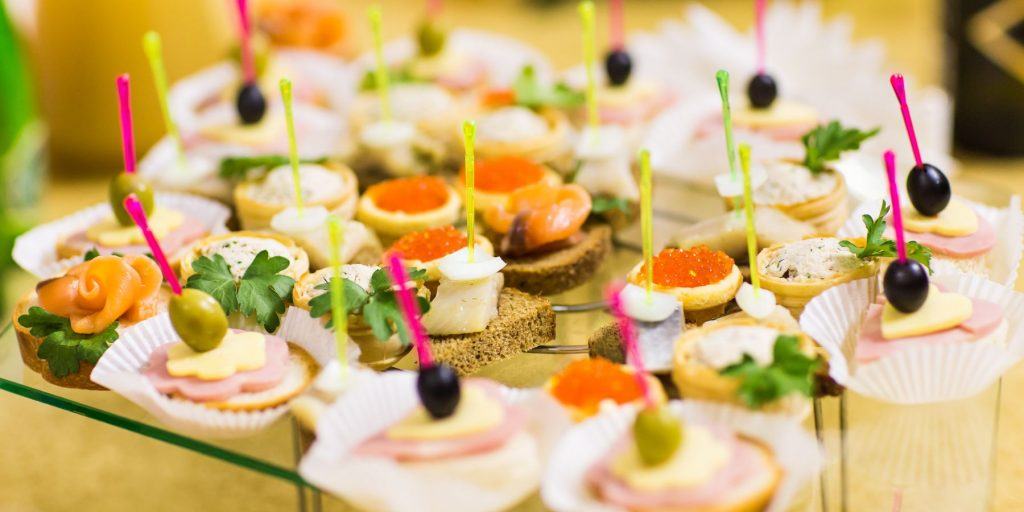 Close up view of a platter of fresh, summery snacks for an outdoor cocktail party