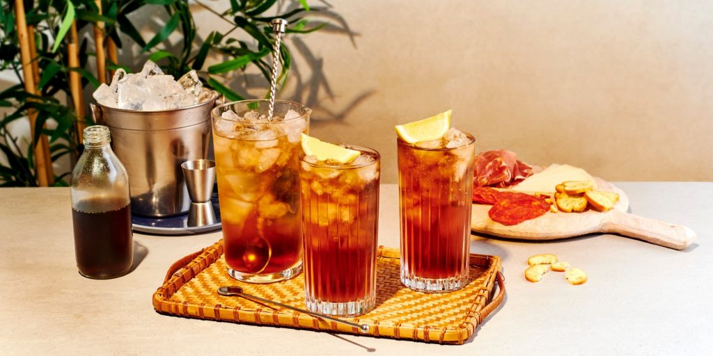 Front image of three homemade Long Island Ice Tea Cocktails with Lemon garnish