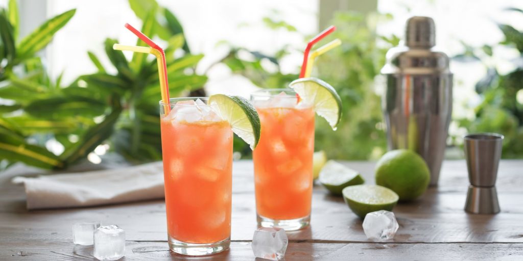 Two Zombie Cocktails served in highball glasses, garnished with lime