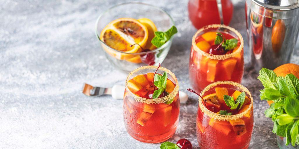 Cocktails with bitters in glasses on a marble board