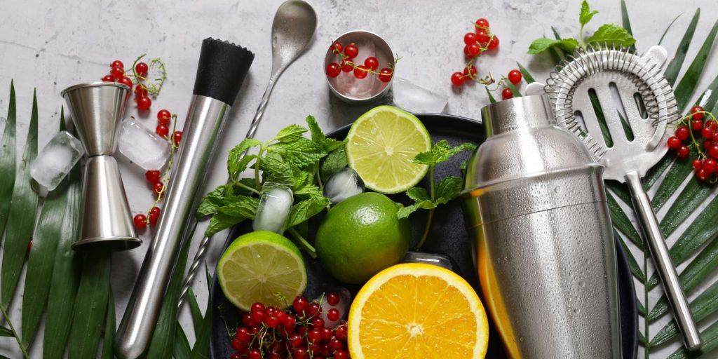 Cocktail kit from above on marble with citrus