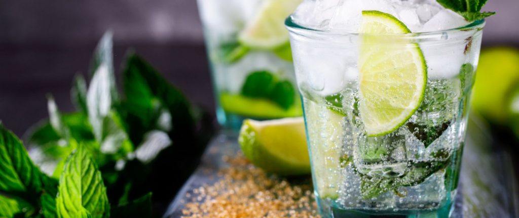 Close up front view of a pair of refreshing Virgin Mojitos with fresh mint and lime