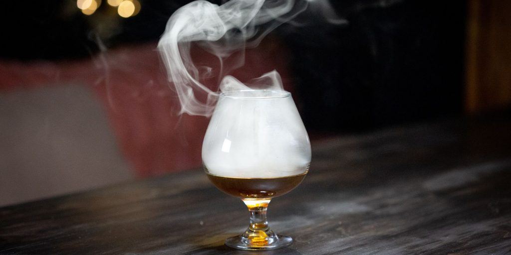 Brandy snifter filled with smoke