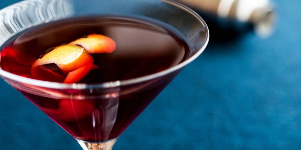 Italian Manhattan in a martini glass with orange peel