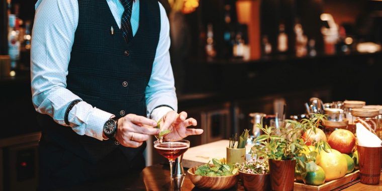 Japanese Bartender garnishing a cocktail