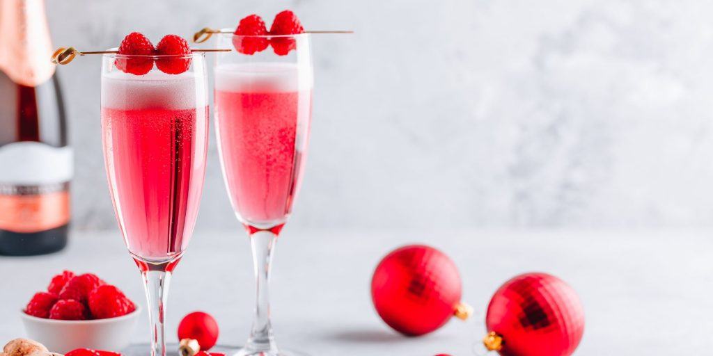 Pink French 75 - An elegant Pink French 75 cocktail, featuring a delightful pink raspberry mimosa with prosecco.