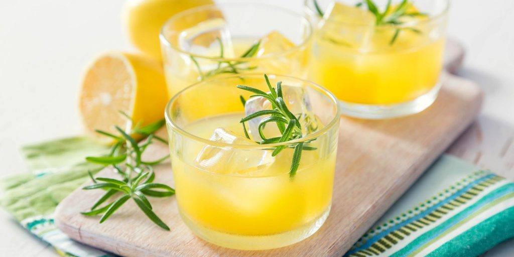 Killer bee cocktails with rosemary garnish