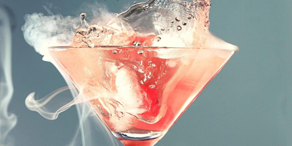 Close-up of smoking dry ice pink martini 