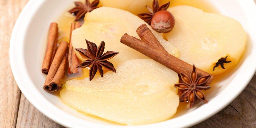 Pear and spice syrup in a white bowl