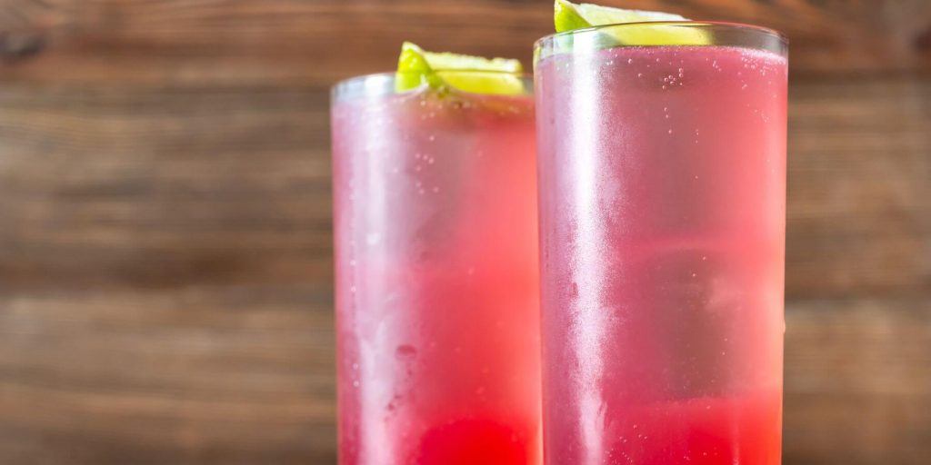 Three dark and stormy cocktails with cherries