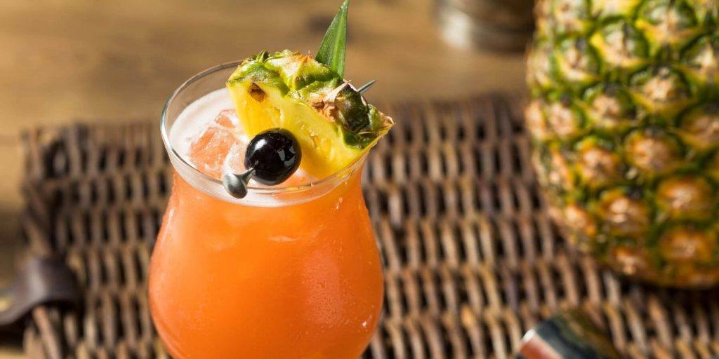 A Singapore Sling in a hurricane glass