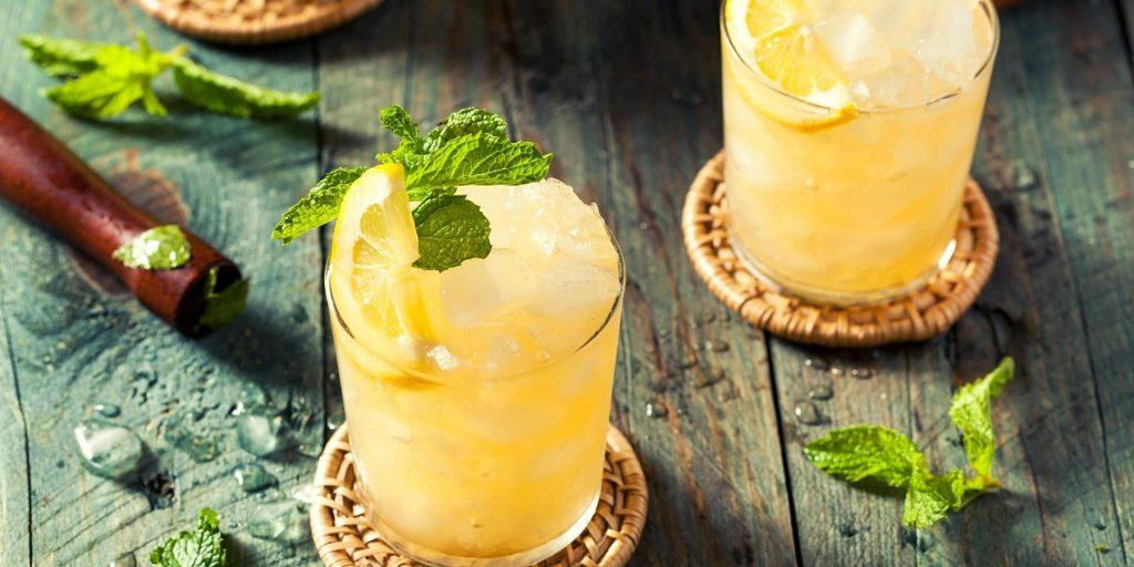 Refreshing Japanese Whiskey Smash cocktails with mint garnish