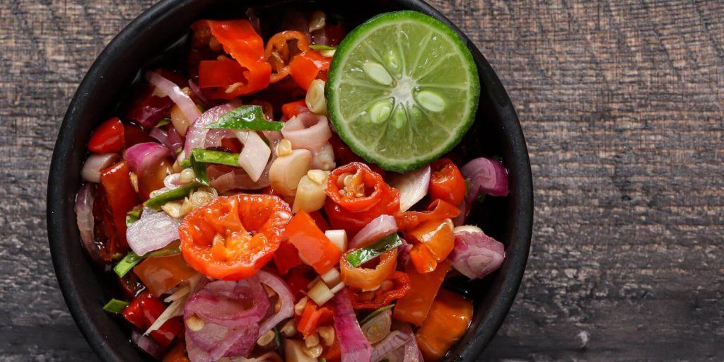 Spicy sambal in a wooden bowl