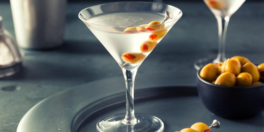 Vodka and vermouth martini with stuffed green olives