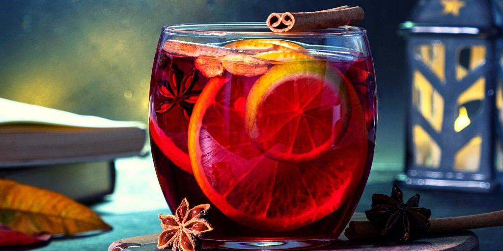Close-up of a Christmas Negroni with orange, cinnamon and star anise garnish