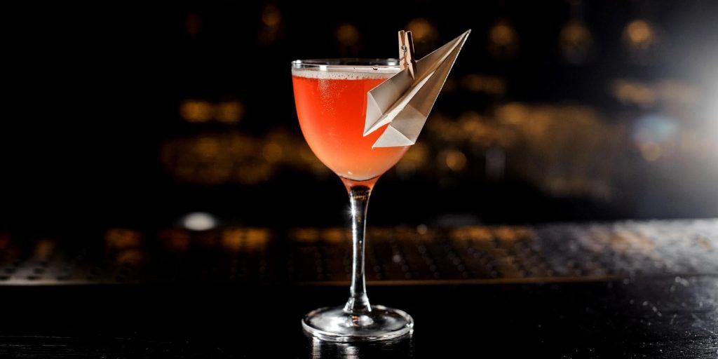 The Paper Plane cocktail, a balanced blend of bourbon, Aperol, and amaro.