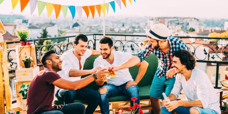 Five friends toasting on a bachelor party