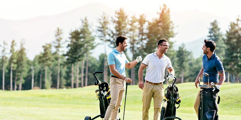 Three friends playing golf