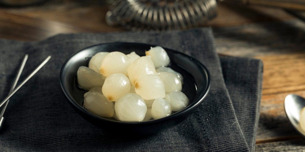 A bowl of white cocktail onions