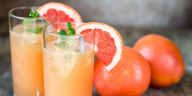 Two Grapefruit Cocktails with grapefruit garnish