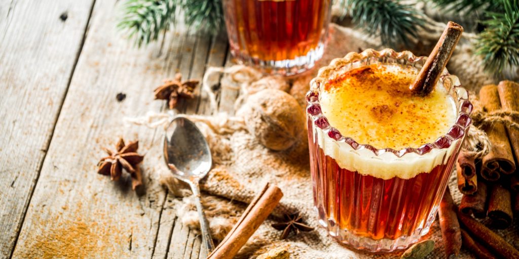 Two Indian Hot Buttered Rum cocktails with whole spices