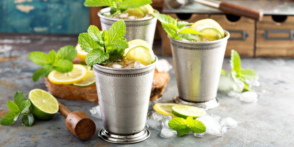 A table of refreshing Nimbu Pani Mint Julep cocktails