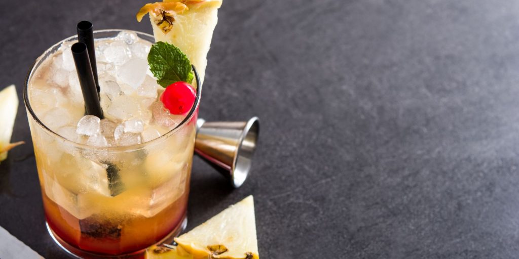 A Well-Oiled Mai Tai served with some pretty tropical garnishes
