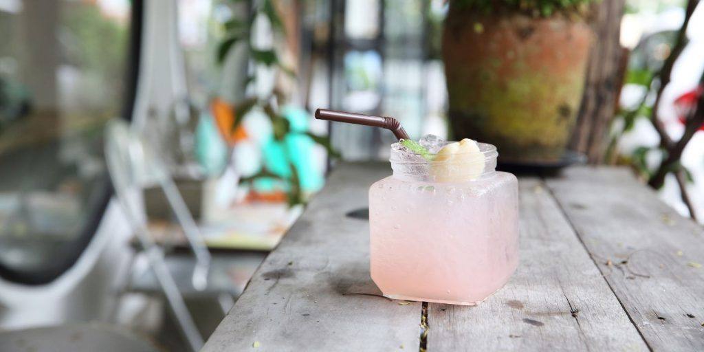 A mesmerising Melting Snow cocktail garnished with a tropical lychee