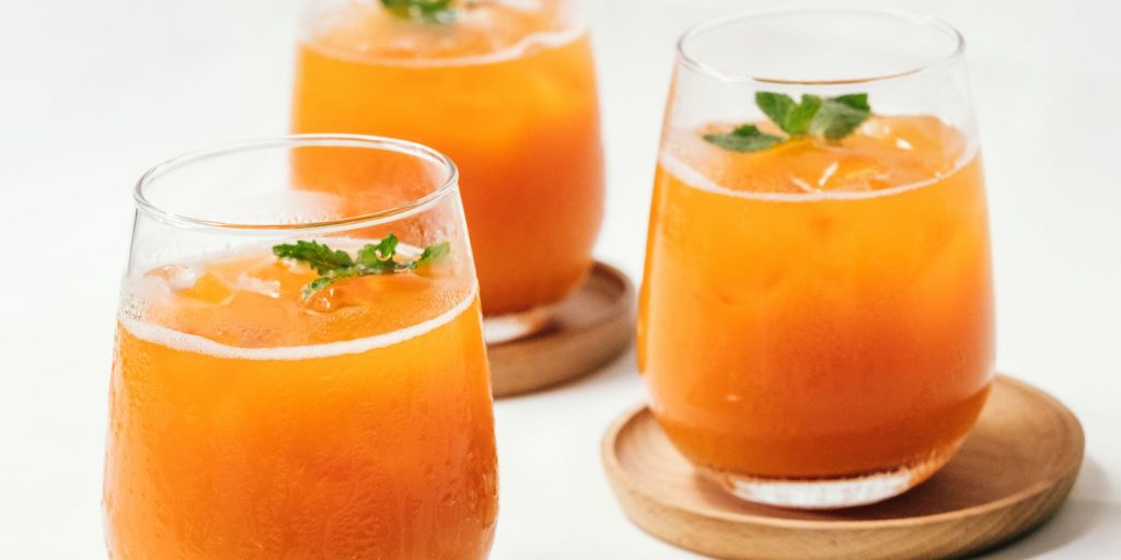 A trio of rum-laced Calabash Citrus Punch cocktails