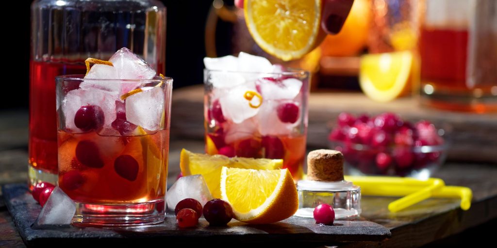 A zesty and delicious pair of Cranberry Orange cocktails in the making