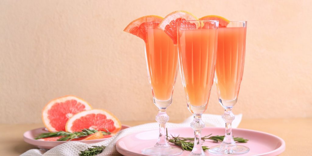 A fruity Mint Grapefruit Mimosa cocktail that sets the scene for romance