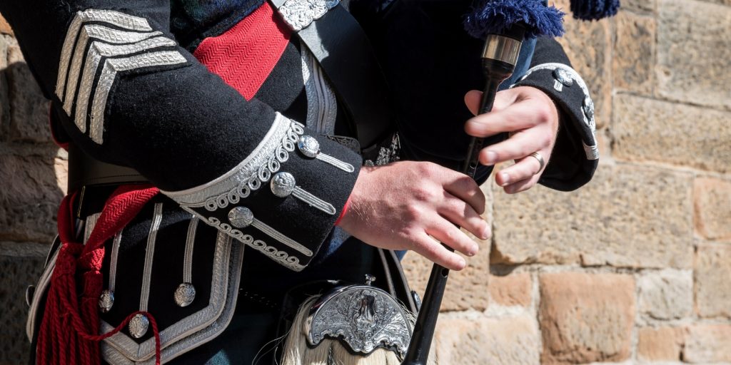 Close up of a man playing bagpipes