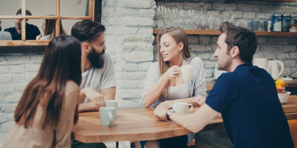 A group of friends planning a party around a table