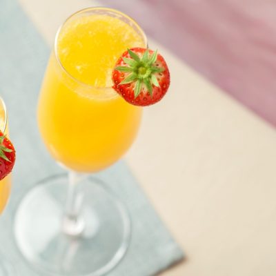 Top shot of two Grand Mimosas with strawberry garnish