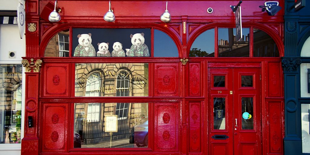 Iconic red door exterior of Panda & Sons