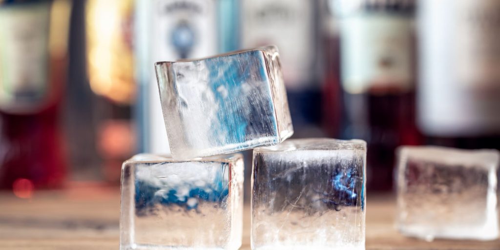 Close up of hand carved clear ice blocks made by freezing water in a cooler