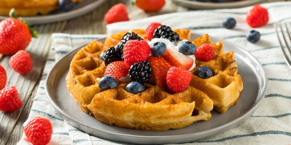 Close up of a plate of waffels with berries