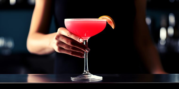 Bartender serving a craft cocktail