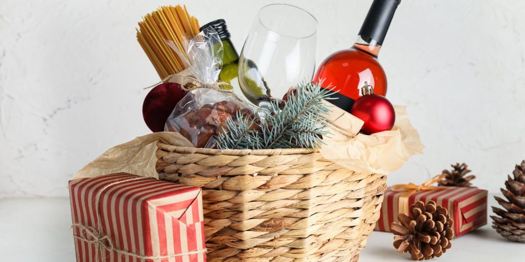 Close up of a cocktail gift set packed up in a pretty basket and decorated for the holidays