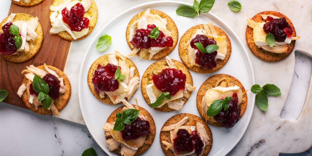 Top view of cranberry and food bites served at a Friendsgiving dinner