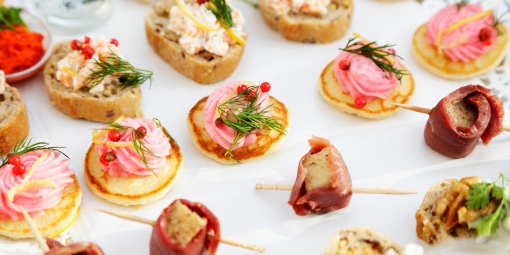 Top view of an array of pretty snacks served up as part of a department food station tour 