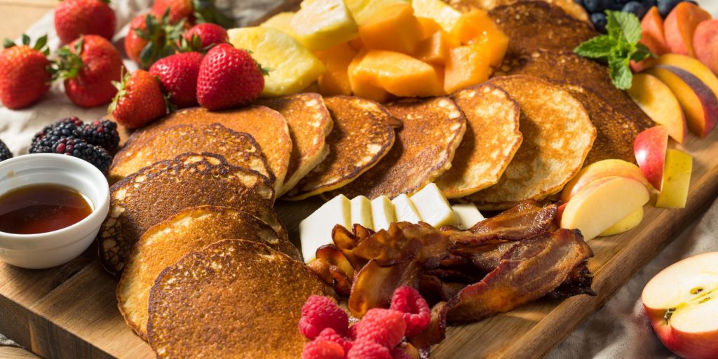 Close up of a breakfast pancake and waffle charcuterie board