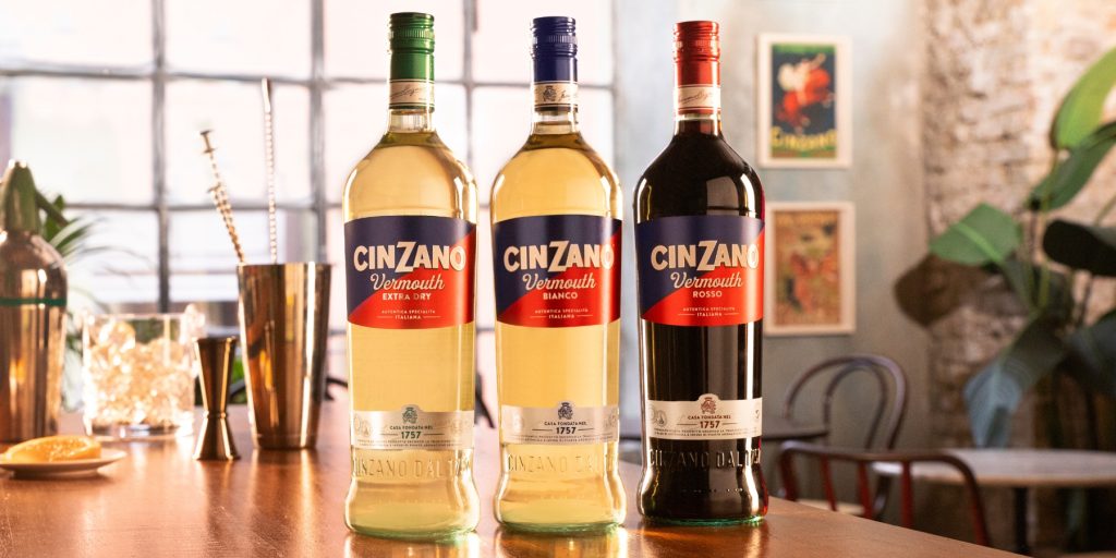 Three bottles of different Cinzano Vermouths, including Bianco, Extra Dry and Rosso