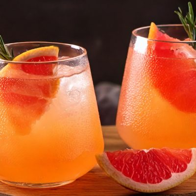 Two refreshing Paloma Mocktails with grapefruit garnish